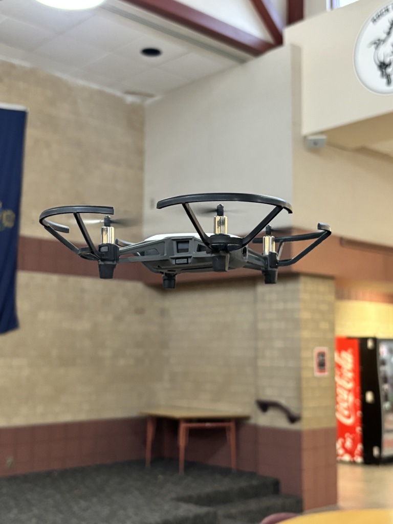 Mr. Lane's 7th grade computers/technology students have been putting their brains to the test this past week! First, they built bridges using a limited "budget" to see which structures could hold a stack of books. Then, they took to the air with their drones! The assignment was to code the drones to fly around the school filming each area, which then would turn into a virtual tour of the building.  #celebrate379