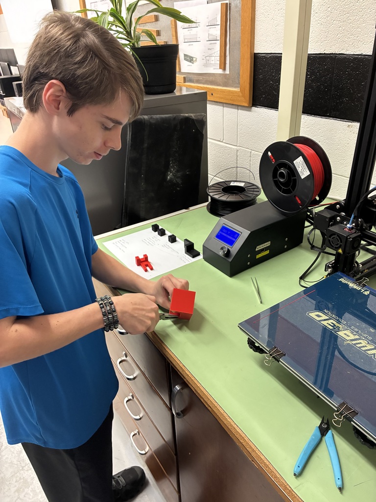 These students in Mrs. Schooley's class are exploring how to use Tinkercad and Fusion. They are using this software to create models and print them with our 3D printer. The models will be used to support the Industrial Arts and CAD I students in identifying the location of visible, hidden, and center lines in their orthographic projections. #celebrate379