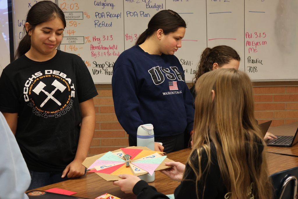🌸🎨 Creativity is blooming in Mrs. Flegler’s class!  Her Floral & Design students are getting close to crafting their own floral patterns after kicking off the year by digging into the science behind how flowers are created. Today, they took things to the next level by teaching one another about the principles and elements of floral design — through games they designed themselves!  From custom board games to inventive computer games, these students proved that learning can be both creative and fun.  #celebrate379
