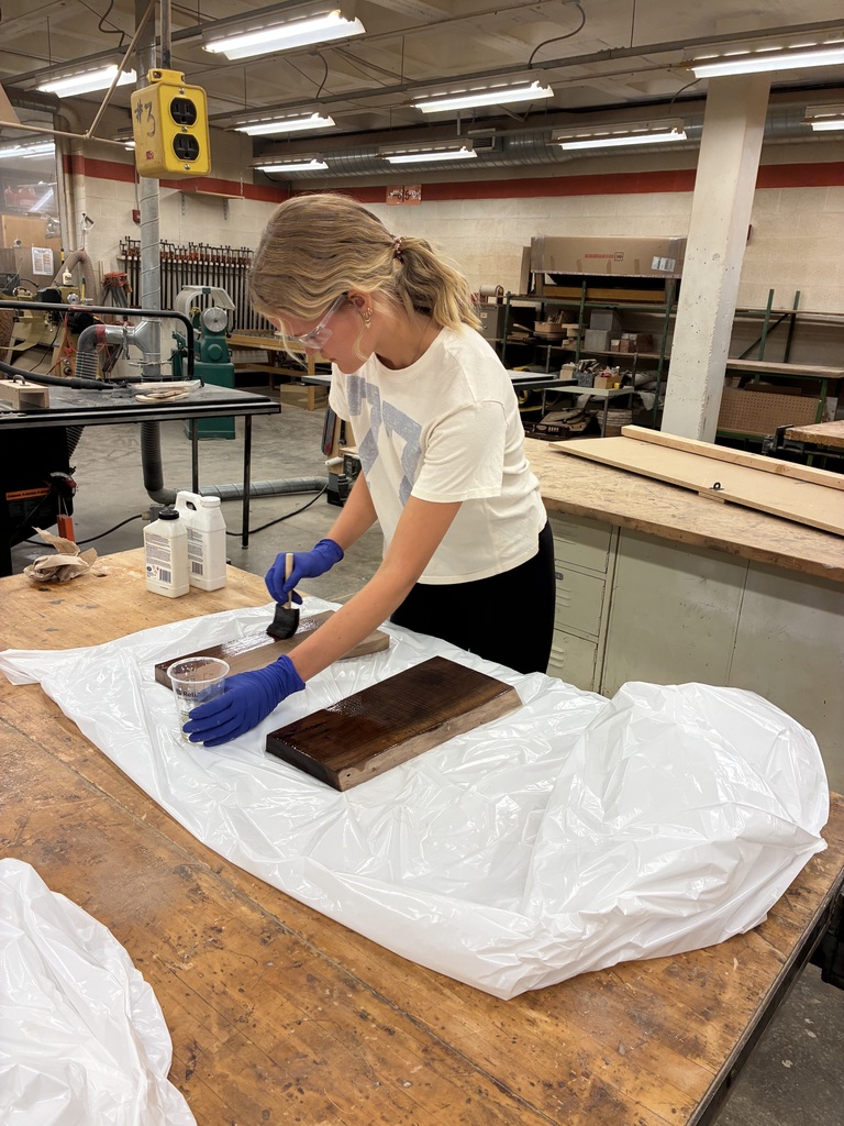 Kylie is interested in Architecture and Design. She thought learning how to build something would be a beneficial experience! She designed and then constructed this nightstand. Mr. Connor was so kind to pop back in to offer support. The top is made out of Walnut with purple Resin.