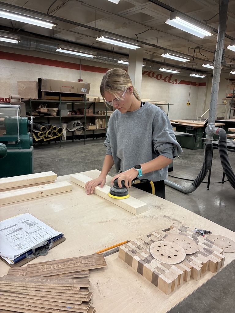 Kylie is interested in Architecture and Design. She thought learning how to build something would be a beneficial experience! She designed and then constructed this nightstand. Mr. Connor was so kind to pop back in to offer support. The top is made out of Walnut with purple Resin.