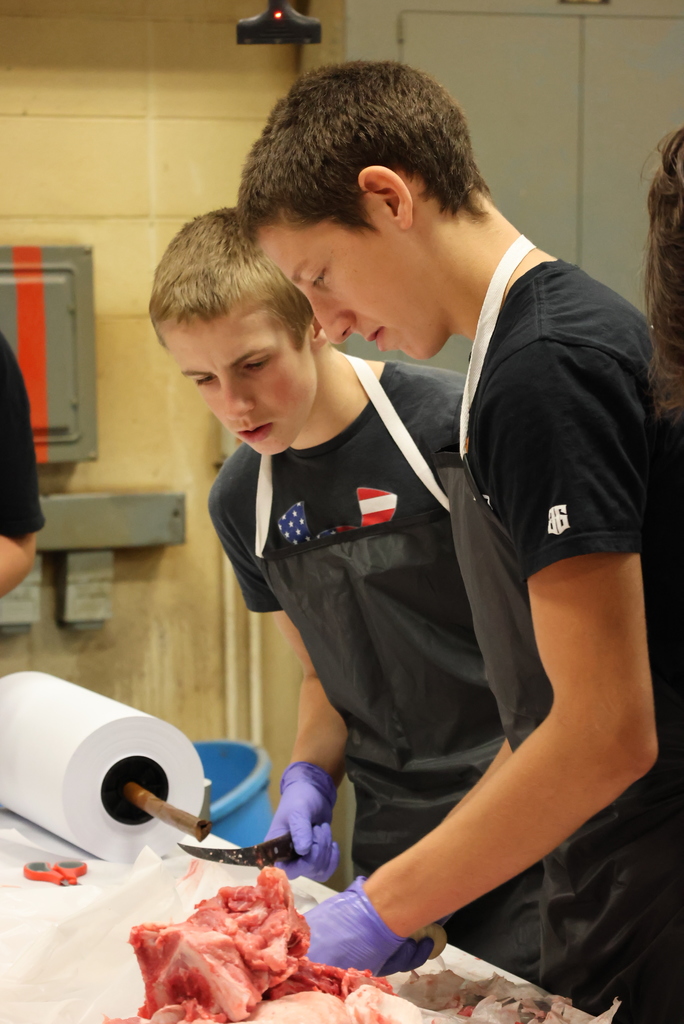 Forget the turkey, Mr. Craig's students were serving up ham this morning!  Schwartz Farms was nice enough to donate a hog for this learning activity, and the Clay Center Locker Plant killed and delivered it whole to the CCCHS Ag garage. After that, it was the students' turn to butcher from whole hog down to all of the parts!  Thanks to Lee Weiss, a retired Ag teacher and FFA advisor, who donated his morning to teach the students all about the butchering process. As you can see, it was a hands-on process!  Some of the pork will be eaten at FFA events, and some will be donated to the Lighthouse. All of it was a great learning experience! #celebrate379