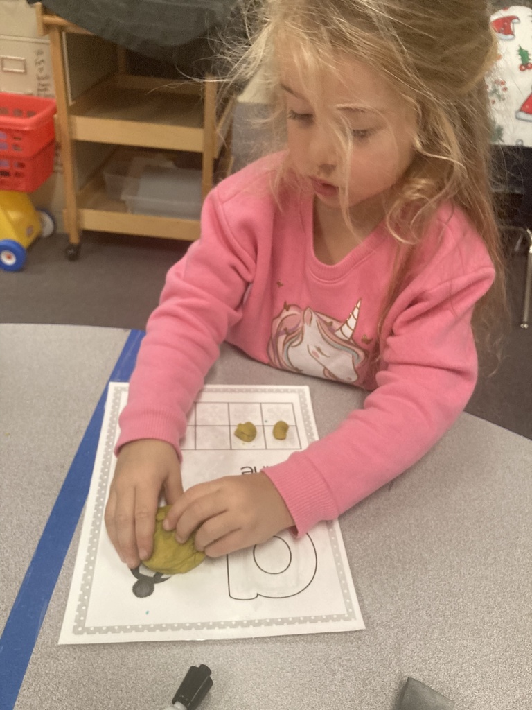 One-to-one object correspondence and number writing were practiced yesterday in Mrs. Bruggeman's PreK class, along with fine motor skills using play dough and dry erase markers! #celebrate379