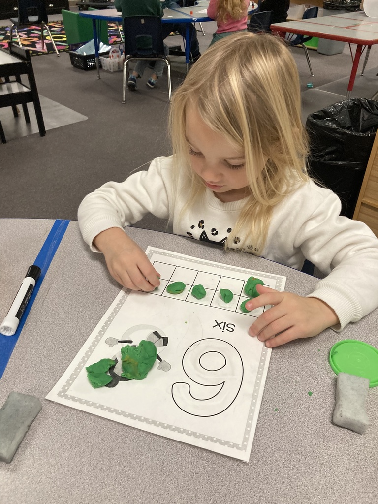 One-to-one object correspondence and number writing were practiced yesterday in Mrs. Bruggeman's PreK class, along with fine motor skills using play dough and dry erase markers! #celebrate379