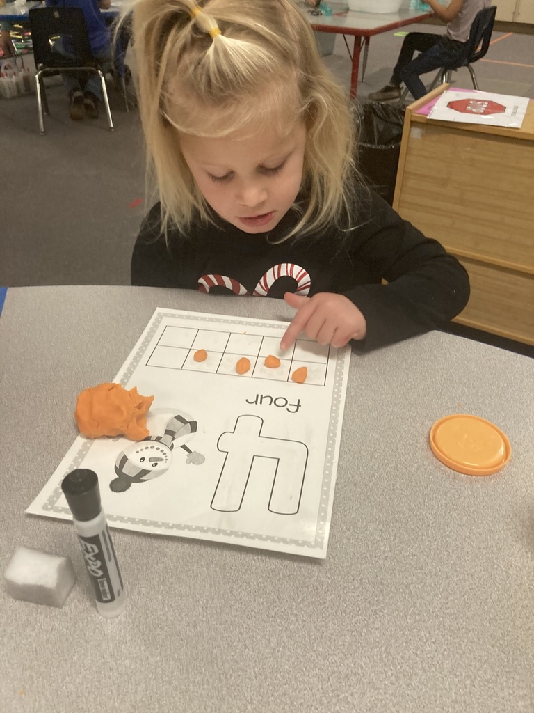 One-to-one object correspondence and number writing were practiced yesterday in Mrs. Bruggeman's PreK class, along with fine motor skills using play dough and dry erase markers! #celebrate379
