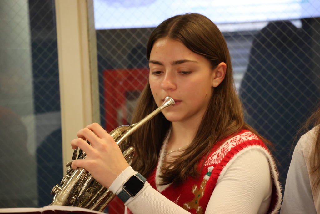 Select members of the CCCHS band surprised community members by playing Christmas songs around the community yesterday... including at Garfield! #celebrate379