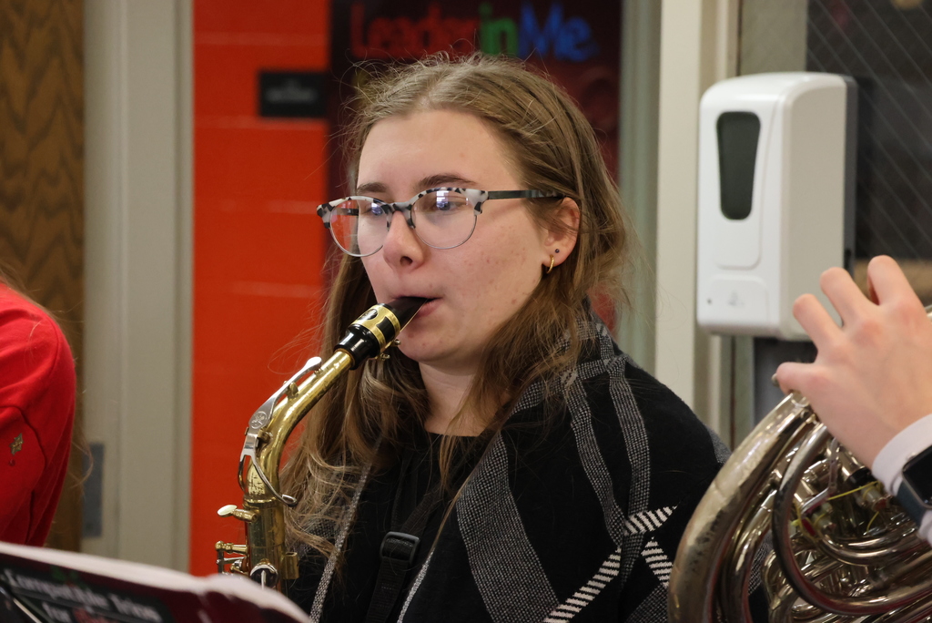Select members of the CCCHS band surprised community members by playing Christmas songs around the community yesterday... including at Garfield! #celebrate379