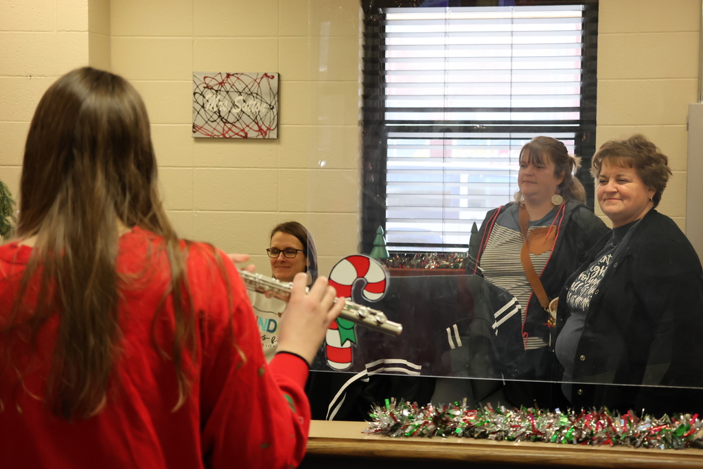 Select members of the CCCHS band surprised community members by playing Christmas songs around the community yesterday... including at Garfield! #celebrate379