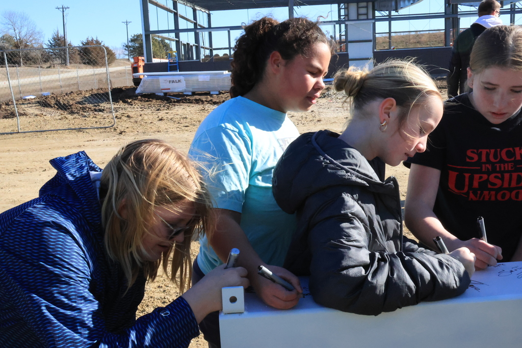 Mrs. Koster's 6th grade ELA students took time this morning to head down the block and sign one of the beams going up in the new Multigenerational Life Center! #celebrate379