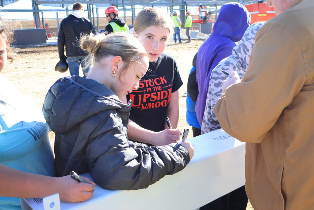Mrs. Koster's 6th grade ELA students took time this morning to head down the block and sign one of the beams going up in the new Multigenerational Life Center! #celebrate379