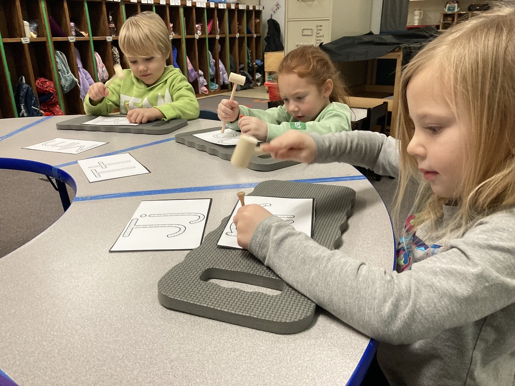 Writing requires strong hand, wrist, and finger muscles! Here are some of the ways Mrs. Bruggeman's Pre-K students wrote letters last week. #celebrate379