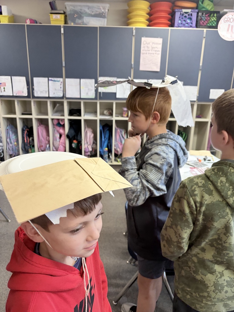 During Ms. Knitter's science class, her second graders explored the different properties of materials used for clothing, such as texture, absorbency, and flexibility. Students were tasked with the challenge to build a hat that best protected them from the sun. They were given aluminum foil, clips, paper bags, paper towels, and string. Creativity ensued! #celebrate379