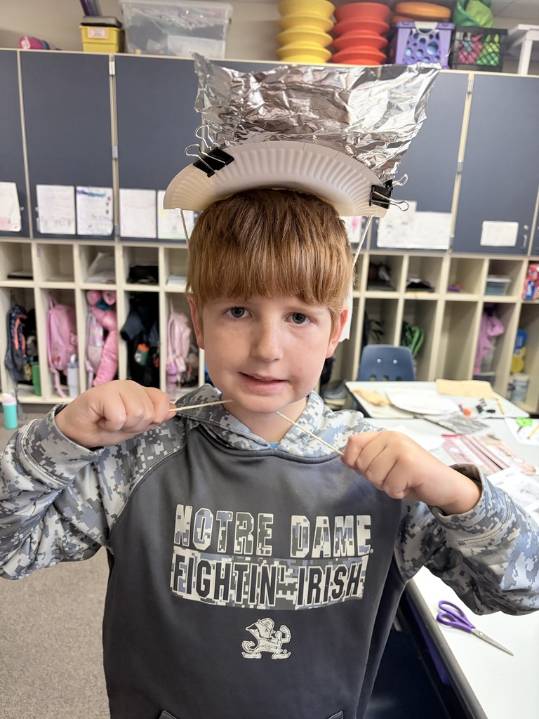 During Ms. Knitter's science class, her second graders explored the different properties of materials used for clothing, such as texture, absorbency, and flexibility. Students were tasked with the challenge to build a hat that best protected them from the sun. They were given aluminum foil, clips, paper bags, paper towels, and string. Creativity ensued! #celebrate379