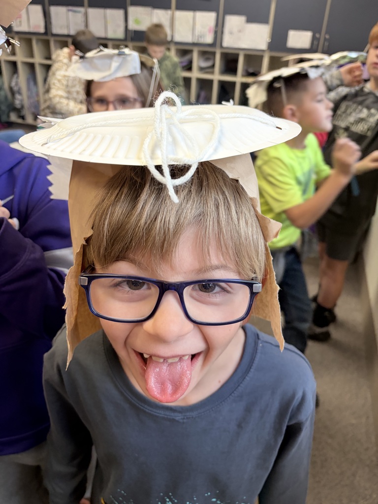 During Ms. Knitter's science class, her second graders explored the different properties of materials used for clothing, such as texture, absorbency, and flexibility. Students were tasked with the challenge to build a hat that best protected them from the sun. They were given aluminum foil, clips, paper bags, paper towels, and string. Creativity ensued! #celebrate379