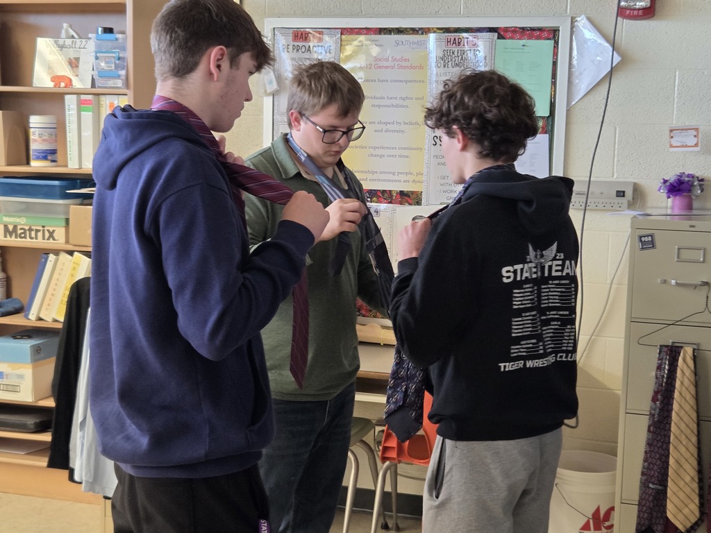 It's getting close to Mock Trial time in government classes! As part of the process, the seniors are teaching each other how to tie neckties! #celebrate379