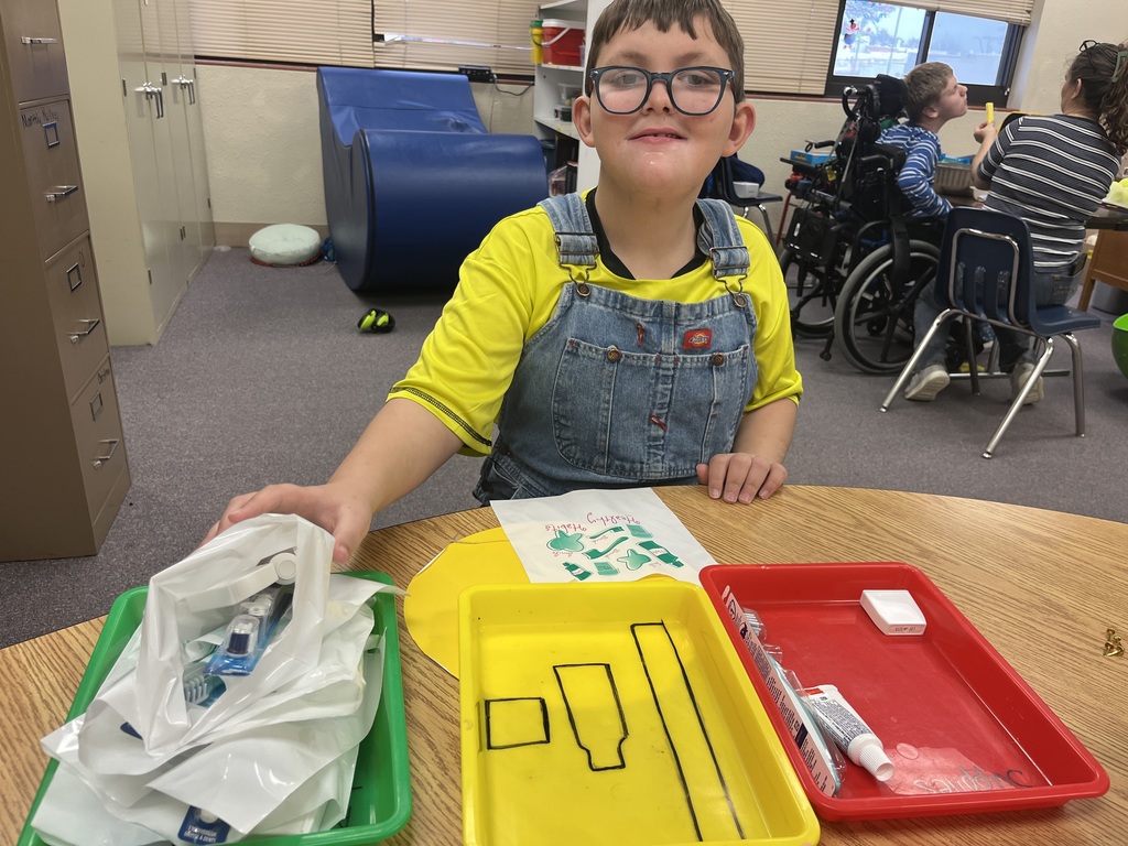 Two Garfield students have been working very hard on life and job skills this school year. They are currently working with a local dentist, Dr. Ferguson, to build the dental bags that are given out at appointments. Chase starts the process by identifying and sorting the items (toothbrush, floss, and toothpaste) and putting them in bins. Morrison then uses the bins, along with a template, to build the set of items needed for each bag. The finished bags will be taken to the dental office for their staff to give to patients. Thank you to Dr. Ferguson's office for supplying the materials for the students to use. It is teaching them important work and life skills! #celebrate379