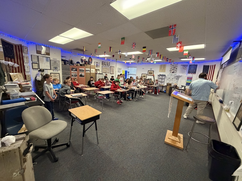 This week, Mrs. Ehlers' third grade class built background knowledge for a story set during the Great Depression. The students were very curious about that time period and had lots of questions about the stock market. Since their 8th grade buddies happened to be in social studies at that same time, they took a quick trip down the hall! Mr. Seuser gave them a crash course on the Great Depression and the stock market and helped answer the students’ many questions. It was a great example of using the knowledge and resources we have right here in our K-12 building! #celebrate379