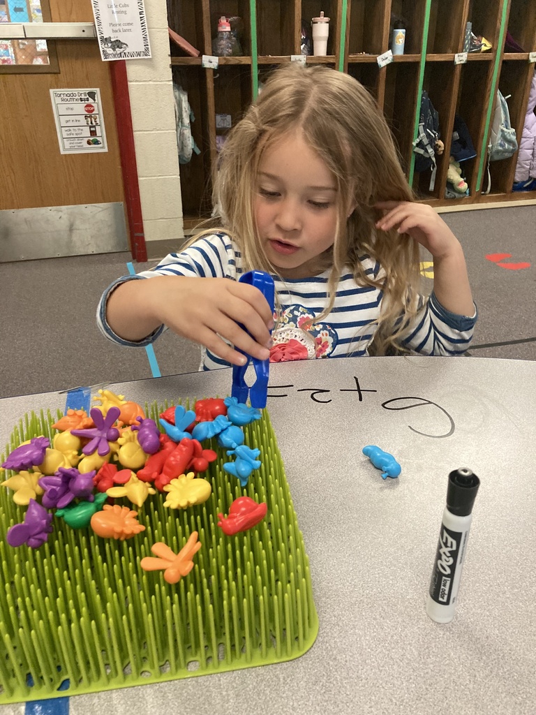 Mrs. Bruggeman's Pre-K students had a fun way to write and solve addition problems today! They did this by using their fine motor skills to pluck bugs from the garden and count them. Don’t tell Mrs. Lane, but they also wrote on the tables! #celebrate379