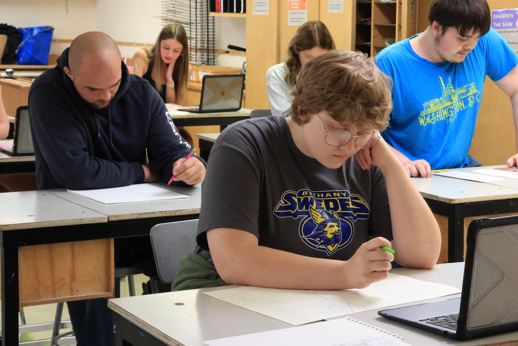 Students work on their self portraits.