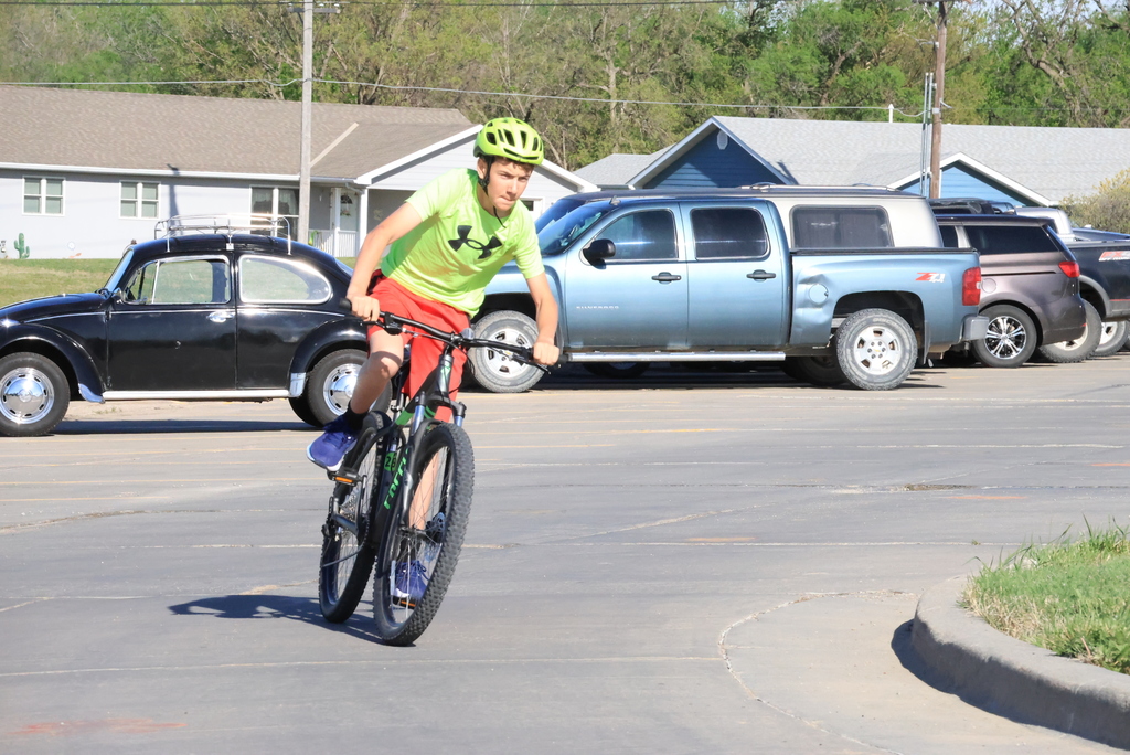 Mr. Smith's 7th grade P.E. students ride bikes in the CCCMS parking lot waiting to leave on their ride around town. #Celebrate379