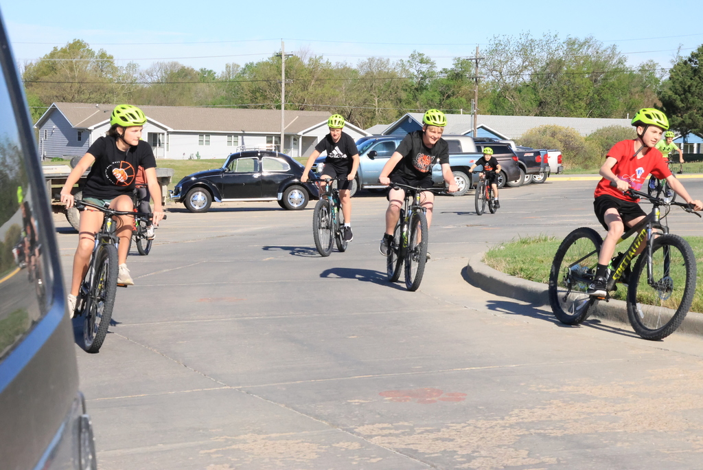 Mr. Smith's 7th grade P.E. students ride bikes in the CCCMS parking lot waiting to leave on their ride around town. #Celebrate379