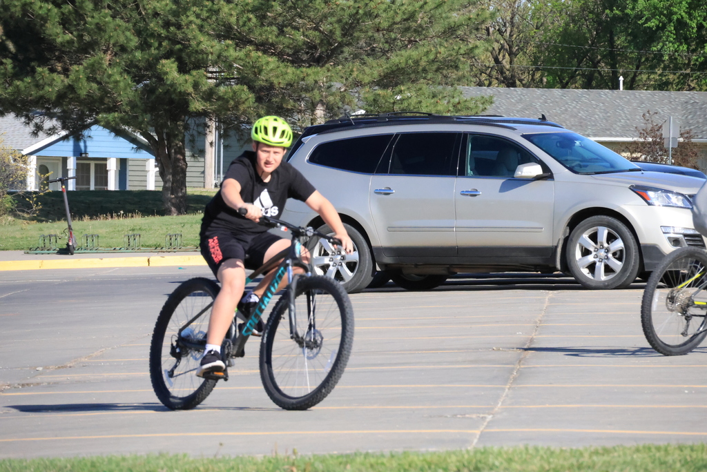 Mr. Smith's 7th grade P.E. students ride bikes in the CCCMS parking lot waiting to leave on their ride around town. #Celebrate379
