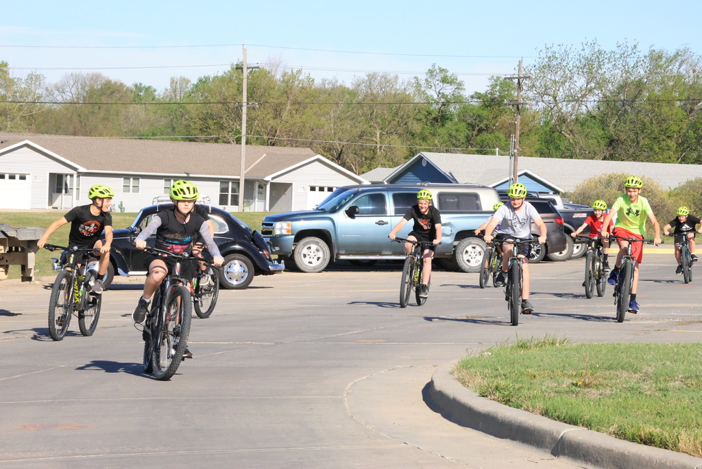 Mr. Smith's 7th grade P.E. students ride bikes in the CCCMS parking lot waiting to leave on their ride around town. #Celebrate379