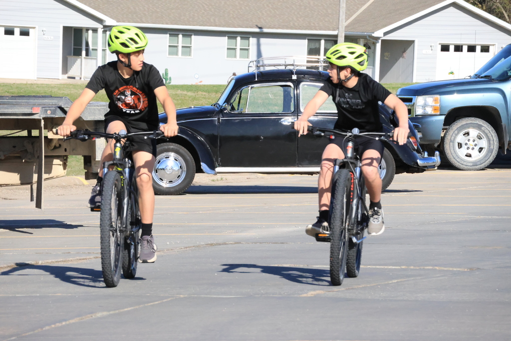 Mr. Smith's 7th grade P.E. students ride bikes in the CCCMS parking lot waiting to leave on their ride around town. #Celebrate379