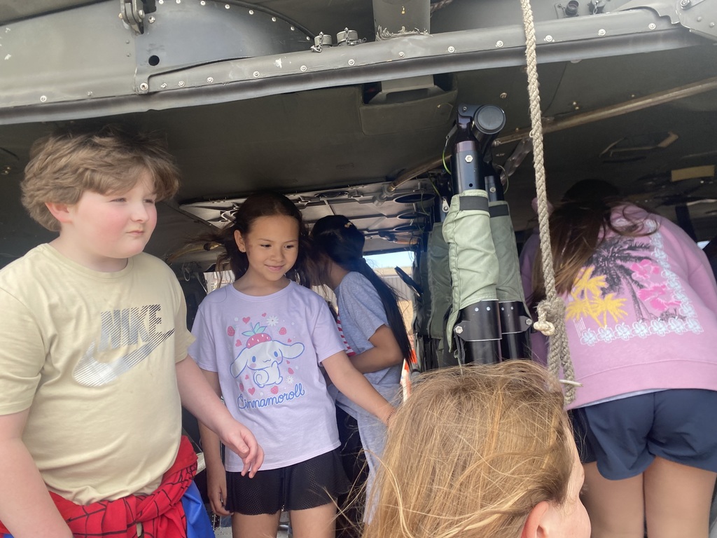 Various 5th graders tour the aviation hangar at Fort Riley and get to sit in a Black Hawk helicopter.