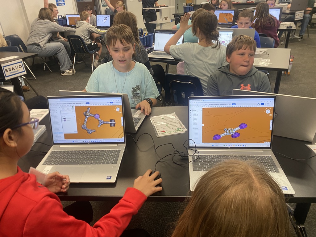 Various 5th graders attend the STARBASE sessions, learning about Newton's laws of motion, how to use a CAD program, how to code robots, and many other science concepts.