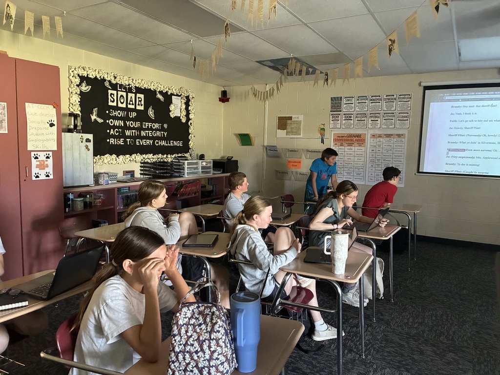 Students laugh and enjoy the play that they helped create.