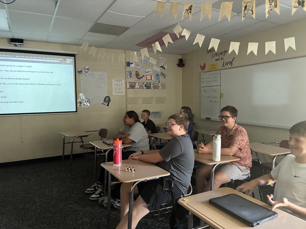 Students laugh and enjoy the play that they helped create.