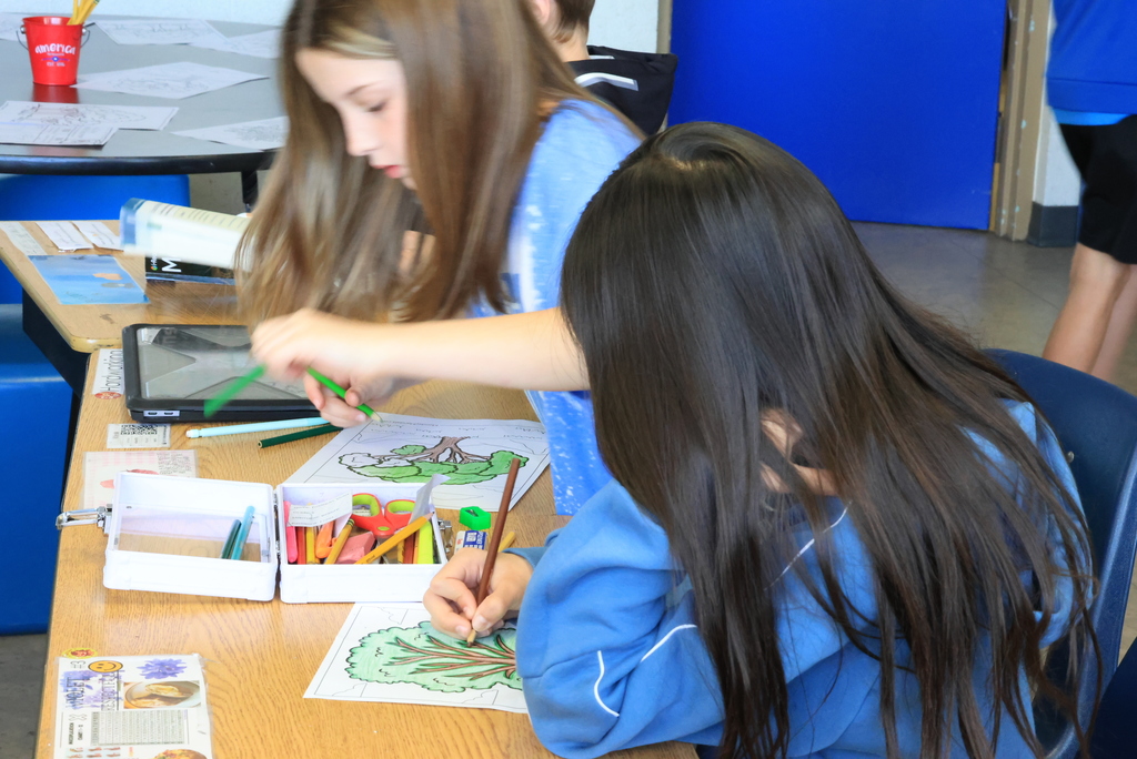 Students color a tree as part of the upcoming Earth Day celebration at Wakefield Elementary.