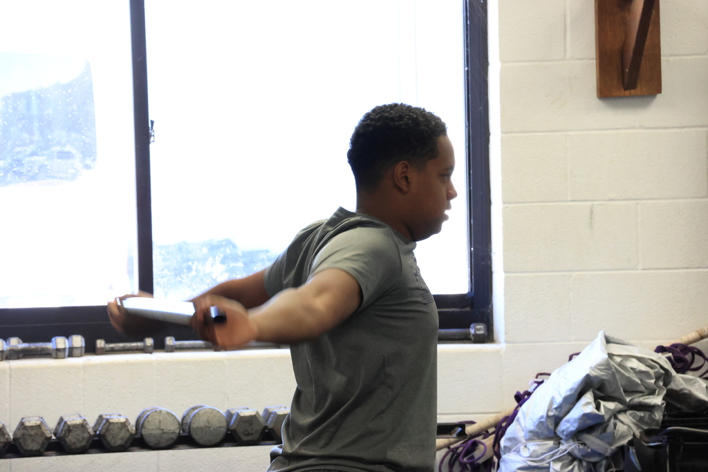 A student stretches in Mr. Freeman's strength and conditioning class.