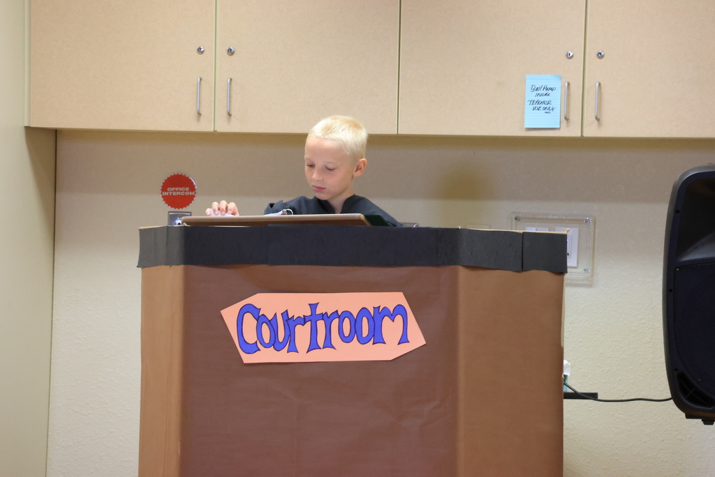 A student serves as the judge during the play, "Blame it on the Wolf".