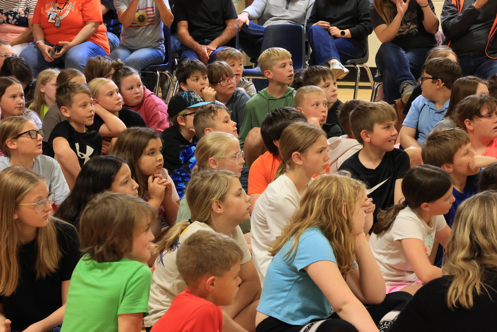 Garfield students sit on the floor and watch the play, 'Blame it on the Wolf."