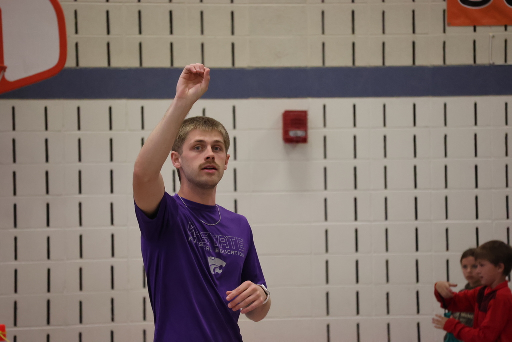 Mr. Beardsley teaches his 2nd graders how to hold and hit a badminton birdie.