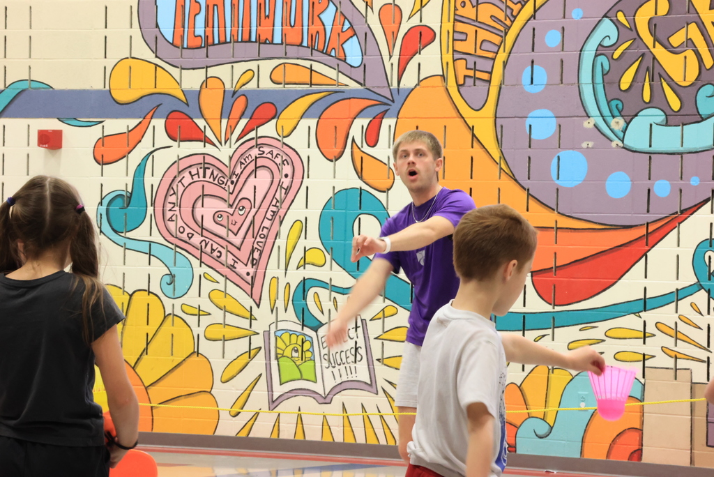 Mr. Beardsley teaches his 2nd graders how to hold and hit a badminton birdie.