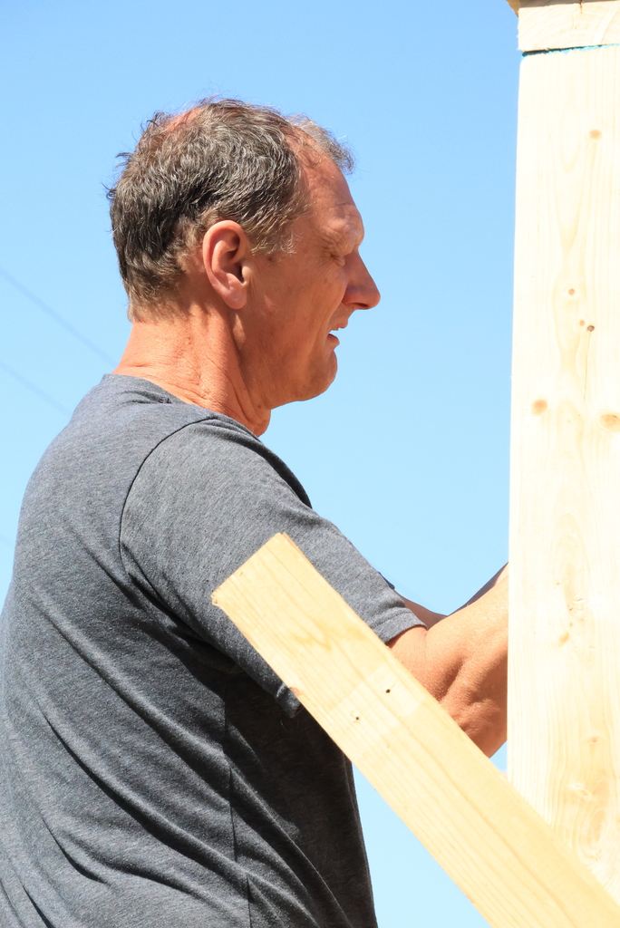 Mr. Couch's industrial arts students work to put up the walls of the 12'x12' shed they are building.