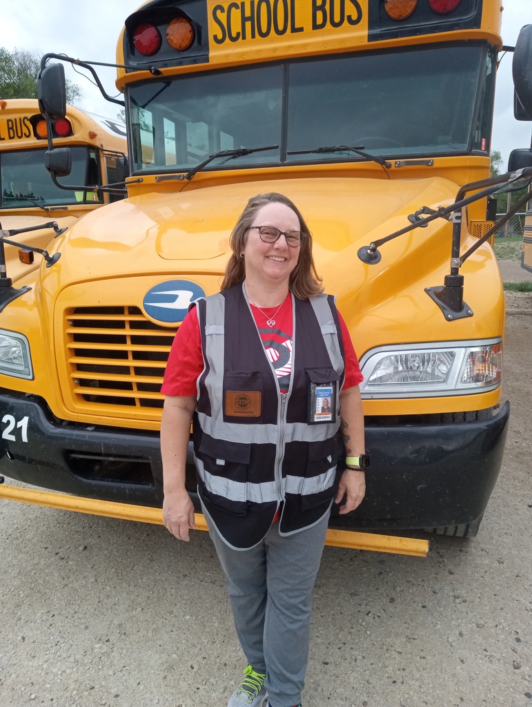 Andrea Ferguson stands in front of a USD 379 school bus. She recently passed all of her testing and has achieved a CDL to drive a school bus.  Andrea has been with the district since the beginning of the school year as a Special Ed driver.