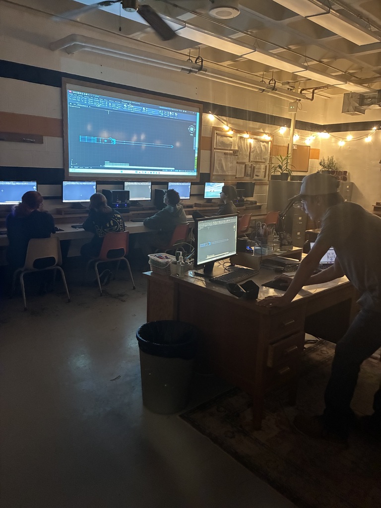 A student in Mrs. Schooley's design-student lab presents their AutoCad command to the rest of the class.