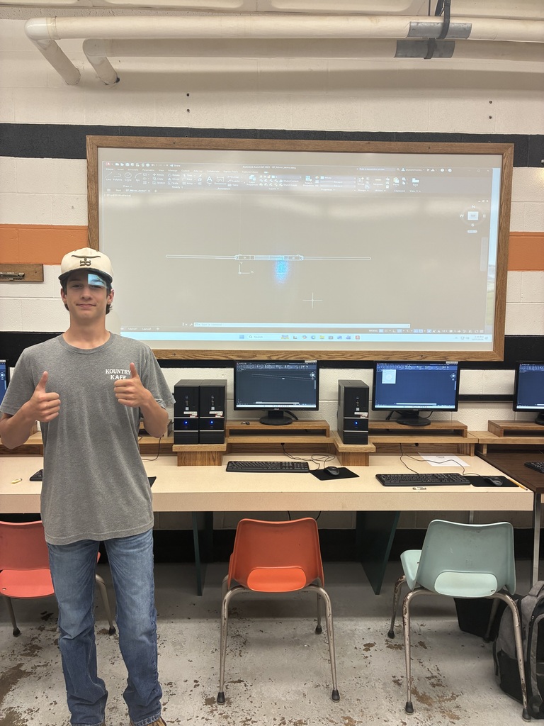 A student gives a thumbs up in front of his AucoCAD command that he learned.