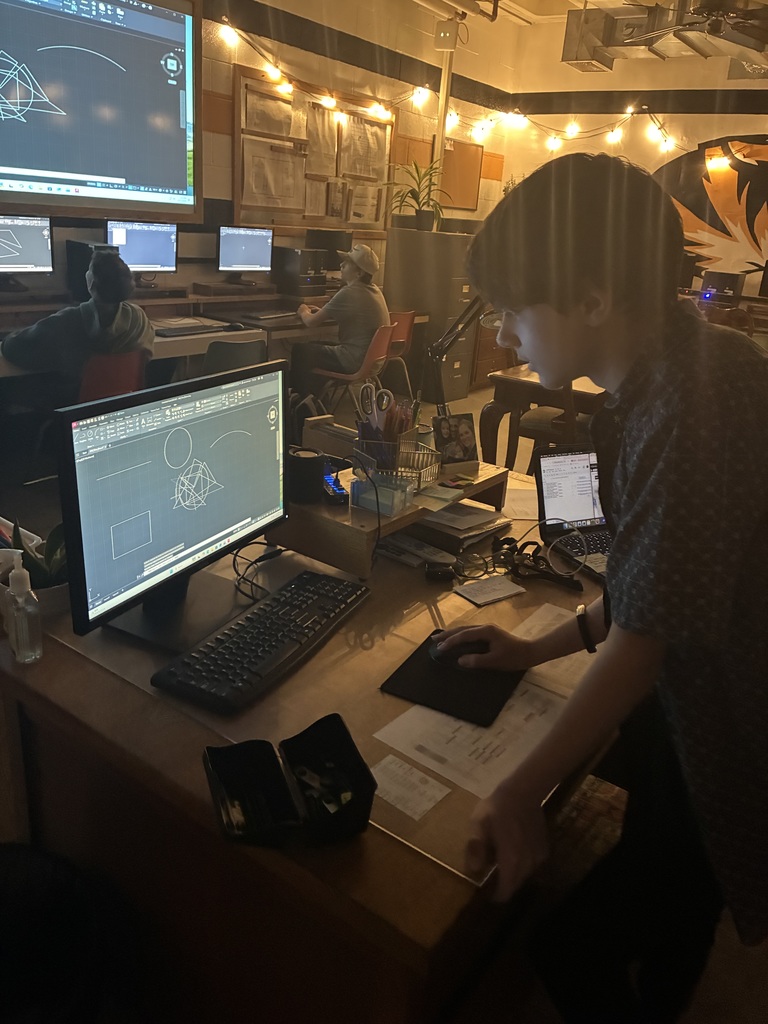 A student in Mrs. Schooley's design-student lab presents their AutoCad command to the rest of the class.