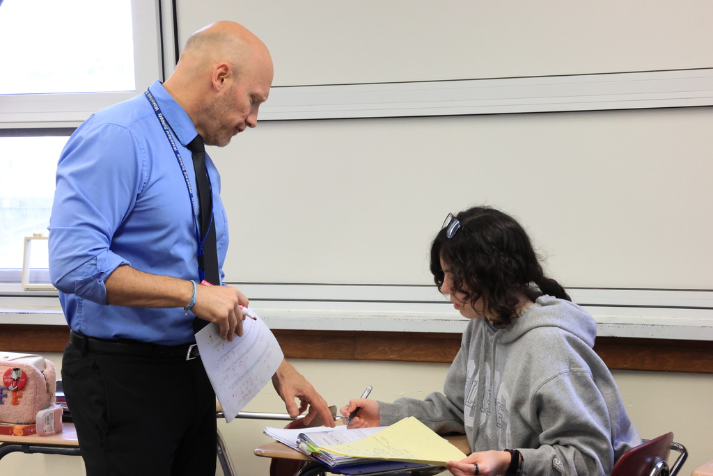 Mr. Freeman helps answer a student's question.