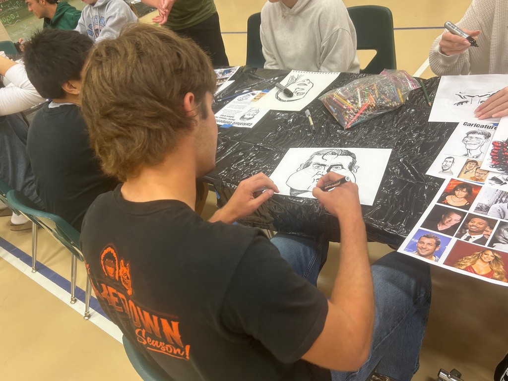 Students work on their art pieces at the NCKL art show in Chapman.