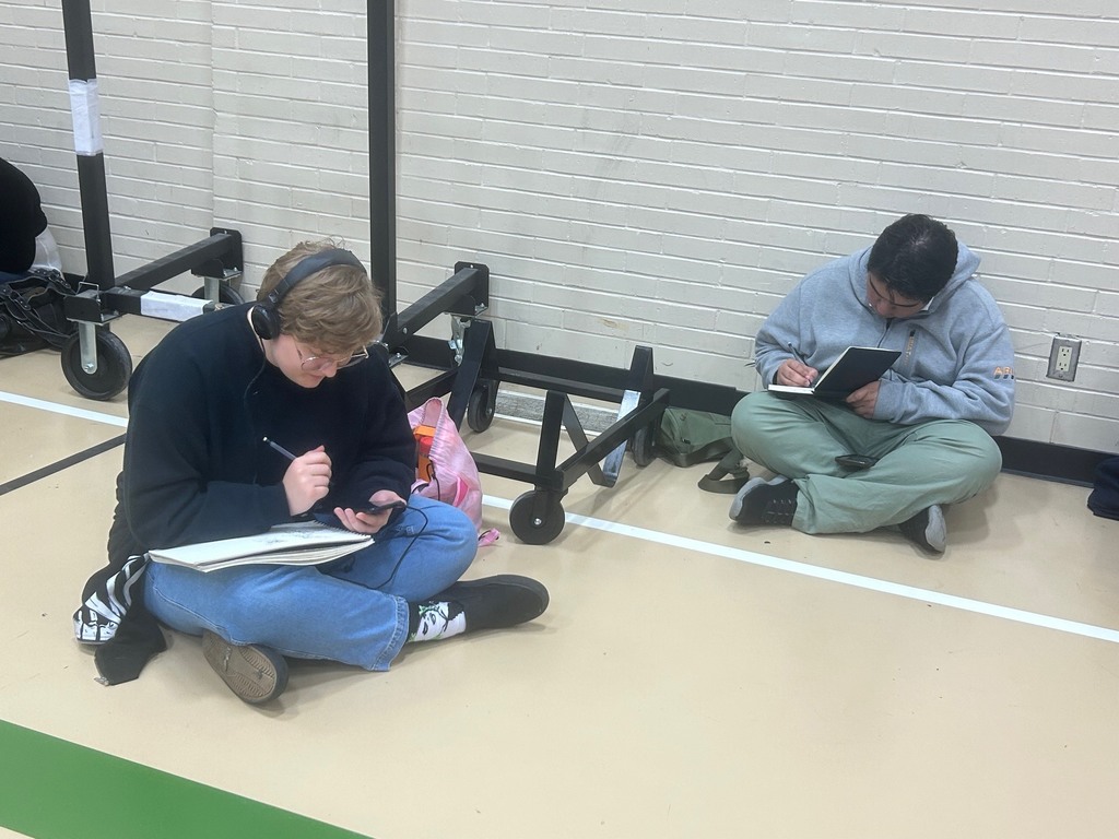 Students work on their art pieces at the NCKL art show in Chapman.