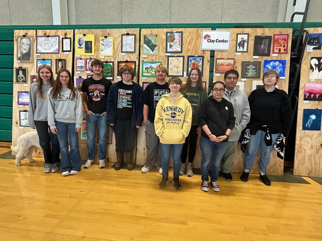 Students pose for a photo at the NCKL art show in Chapman.