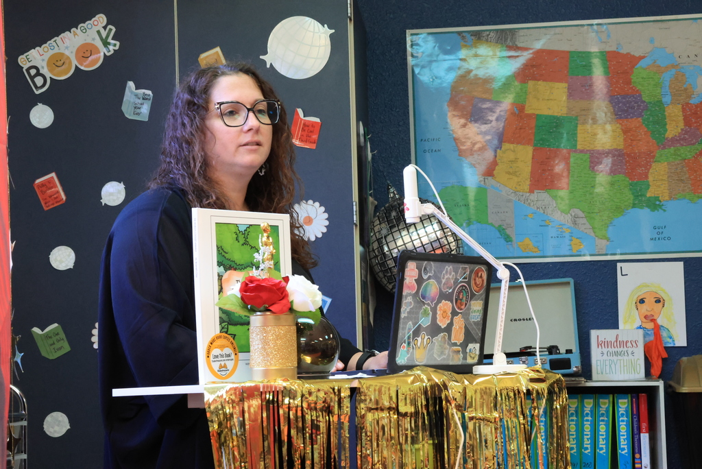 Ms. Brownell talks to the class before their reading.