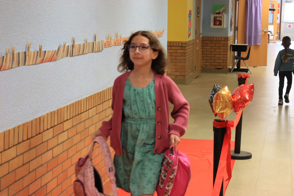 A student walks the red carpet entering Ms. Brownell's classroom.