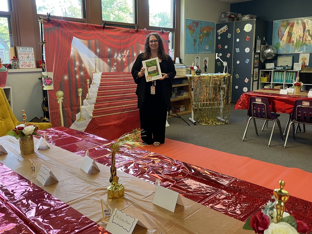Ms. Brownell shows off her class book and decorations for their class reading.